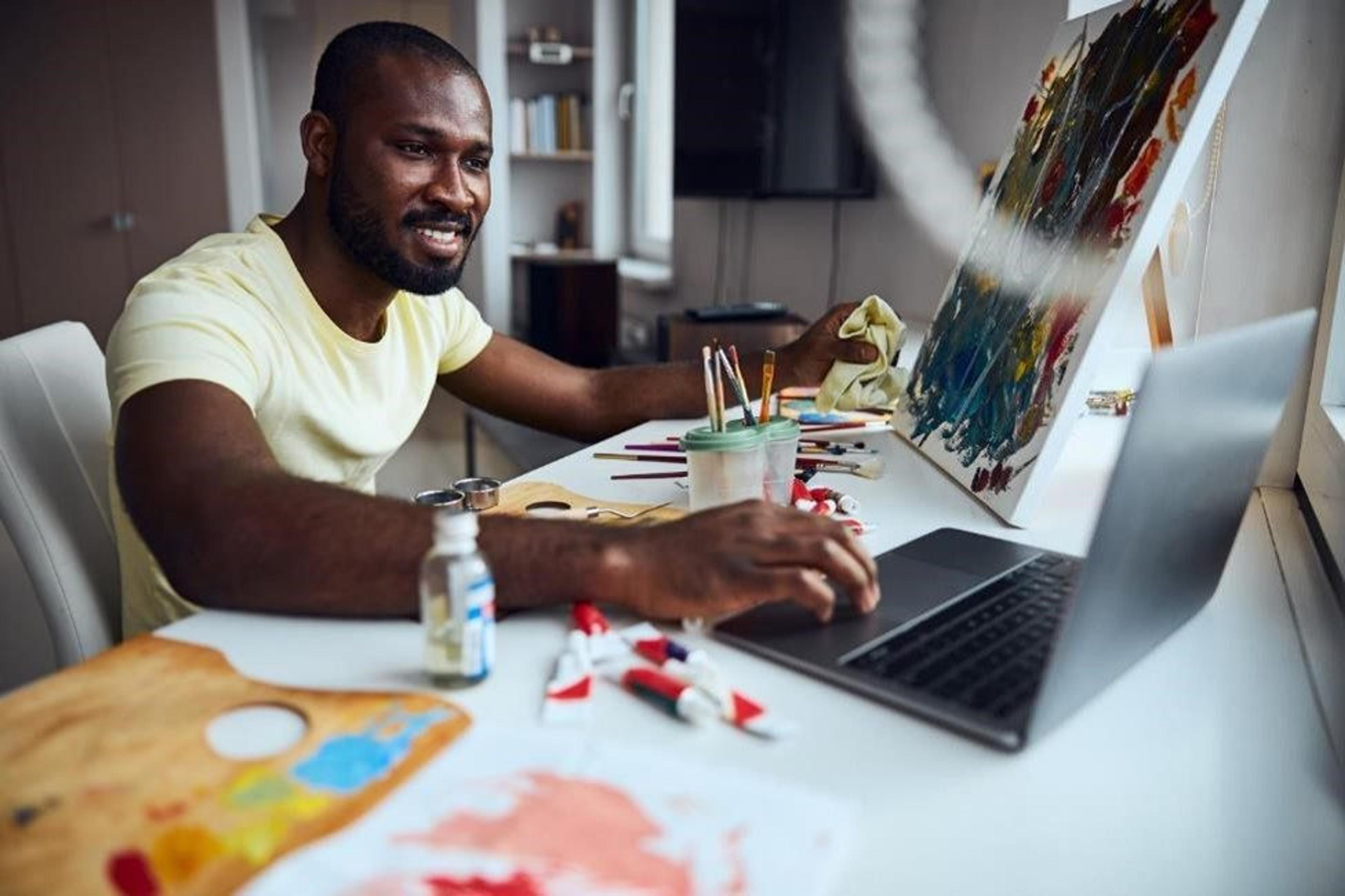 A man painting in his hobby room