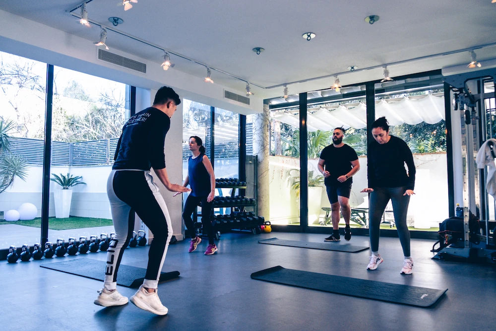 Photo of a fitness class where clients are warming up