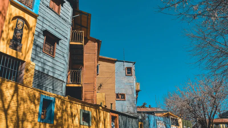 Colorful buildings on El Caminito street in Buenos Aires, featuring vibrant murals and balconies