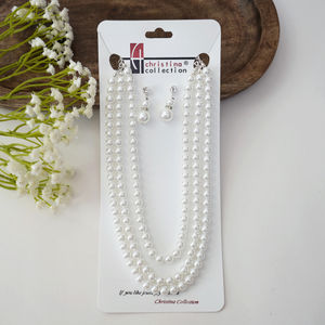 Triple Strand Pearl Necklace And Earrings Product Image