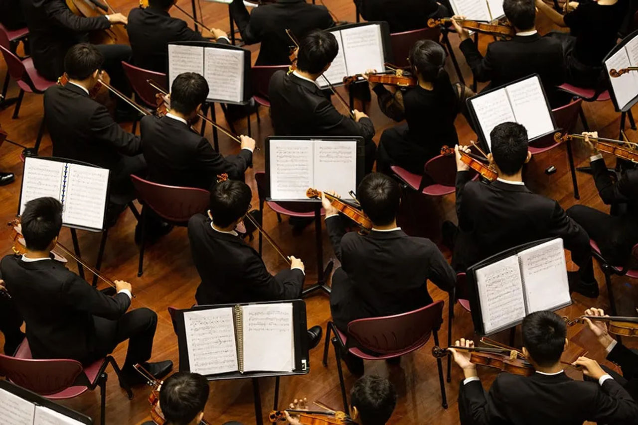 Musicians rehearsing in a music room