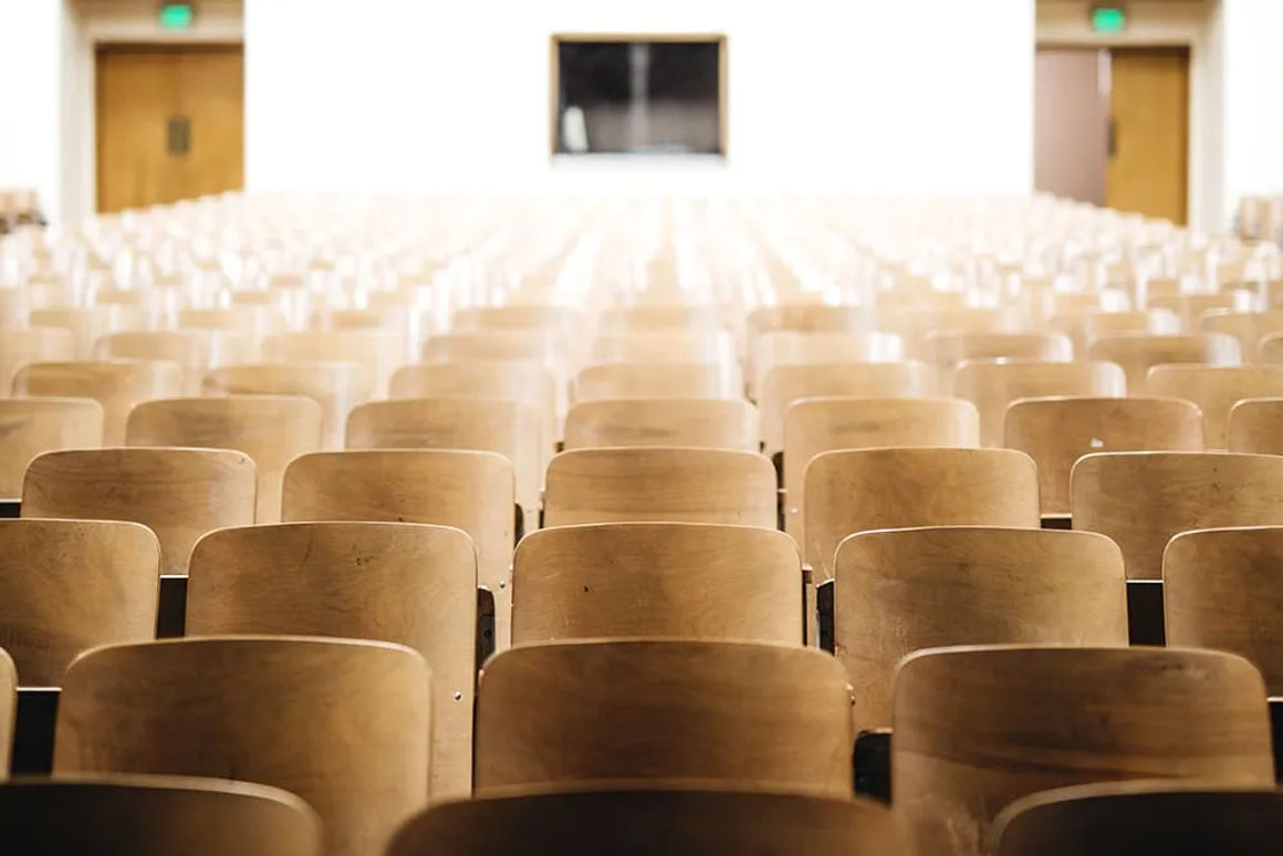 Auditorium seating facing a theater stage