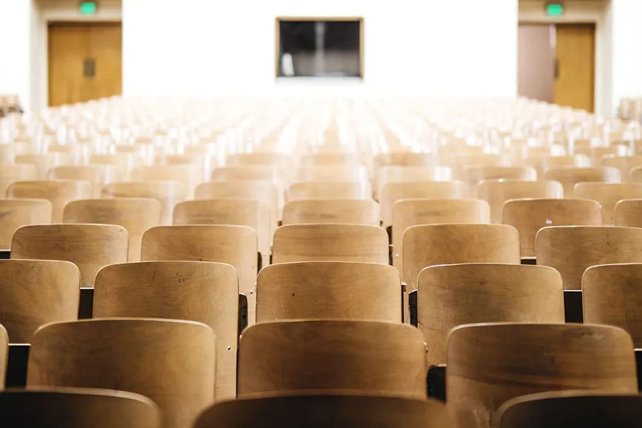 Auditorium seating facing a theater stage
