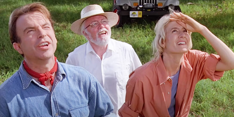 Alan, John, and Ellie looking up at a dinosaur offscreen in Jurassic Park
