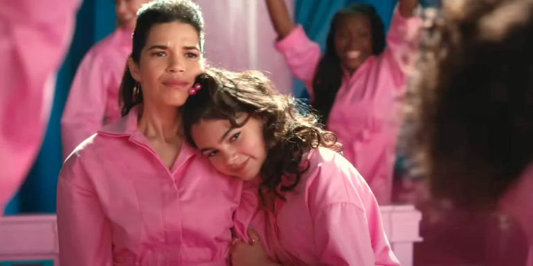An image of America Ferrera and Ariana Greenblatt hugging in Barbie