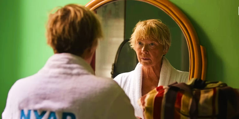 Annette Bening looking in the mirror in Nyad