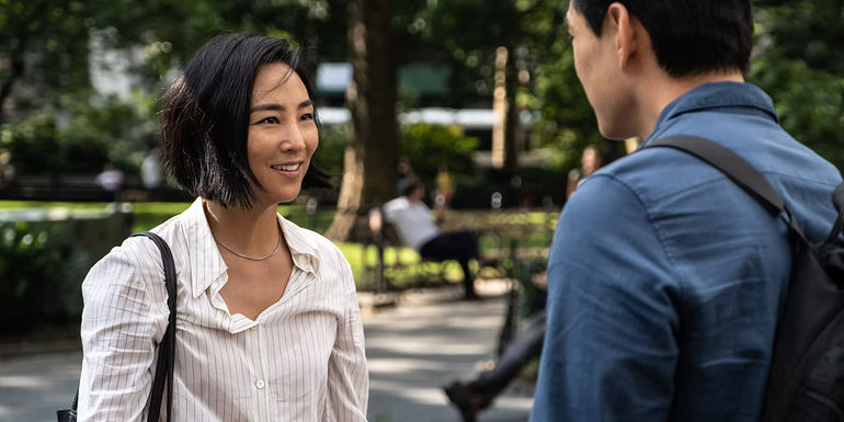 Greta Lee as Nora smiling in Past Lives
