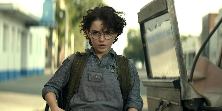 Mckenna Grace's Phoebe sitting in the Ecto-1's car seat in Ghostbusters Afterlife