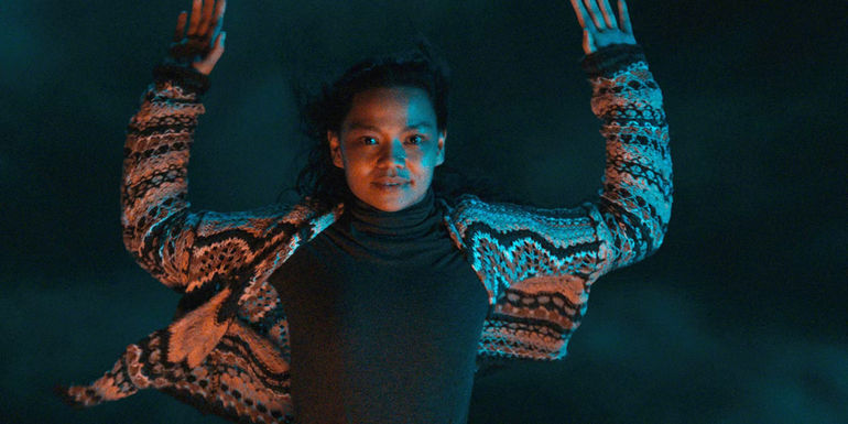 Diana (Chai Fonacier) with her arms outstretched during a ritual in Nocebo