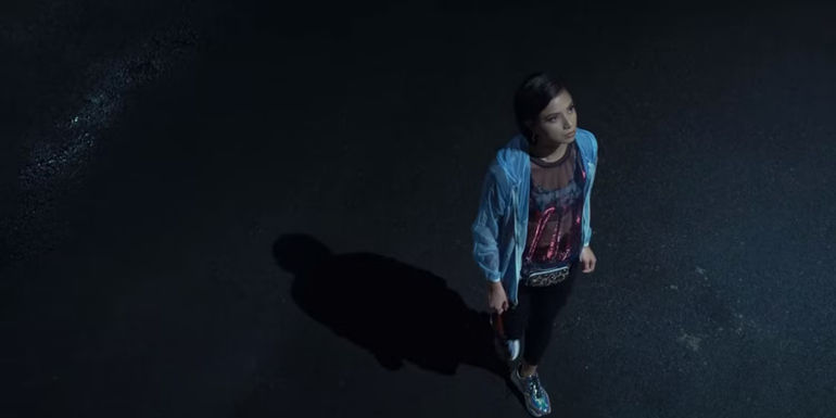 Jinka (Glaiza De Castro) walking in the street at night in Midnight in a Perfect World