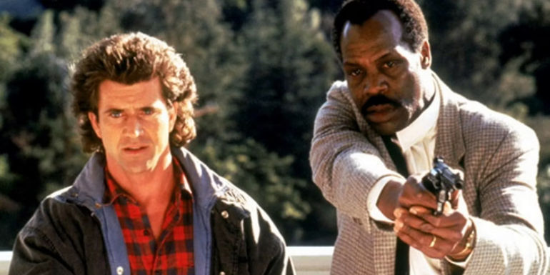 Riggs and Murtaugh standing side by side in Lethal Weapon 2