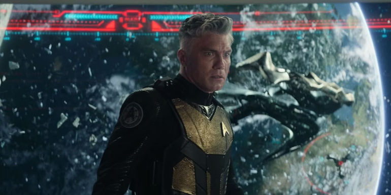 Captain Pike looks horrified with the Cayuga wreckage onscreen behind him Strange New Worlds Hegemony