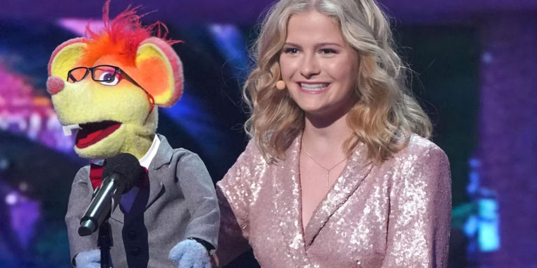 Darci Lynne on stage with a puppet on America's Got Talent