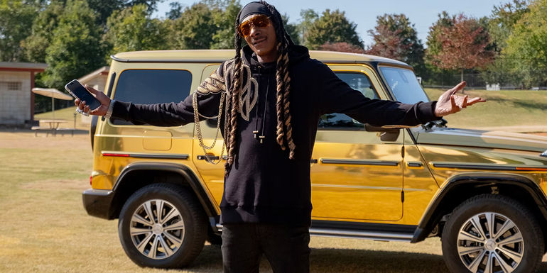Snoop Dogg as Two Js in front of golden Mercedes in The Underdoggs