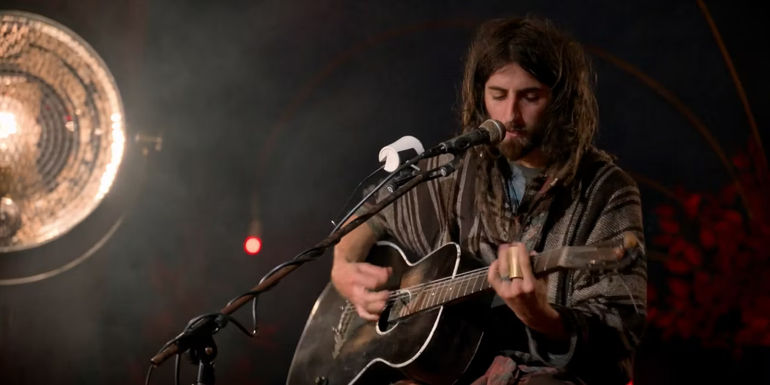 Cam Cole sings and plays the guitar in Ted Lasso