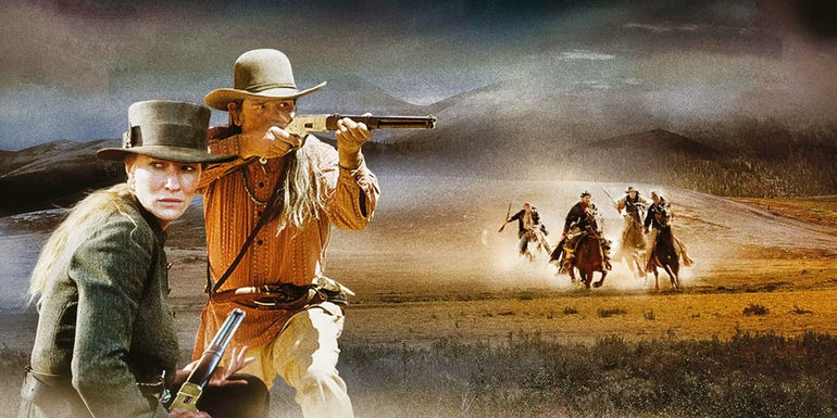 Tommy Lee Jones pointing a rifle with Cate Blanchett against the landscape in The Missing