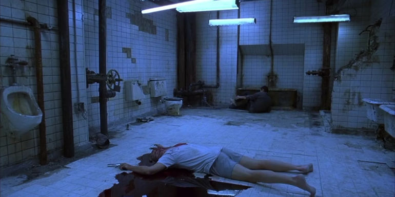 The Bathroom Trap from Saw 1 with a bloody body on the floor