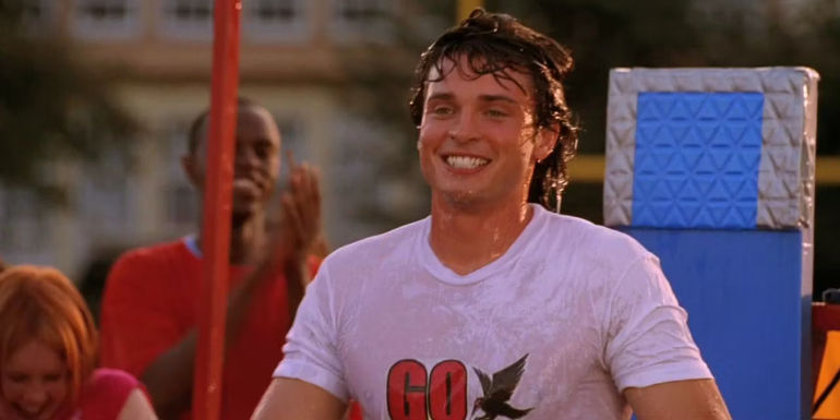 Tom Welling's Clark Kent soaking wet after falling into a dunk tank in Smallville