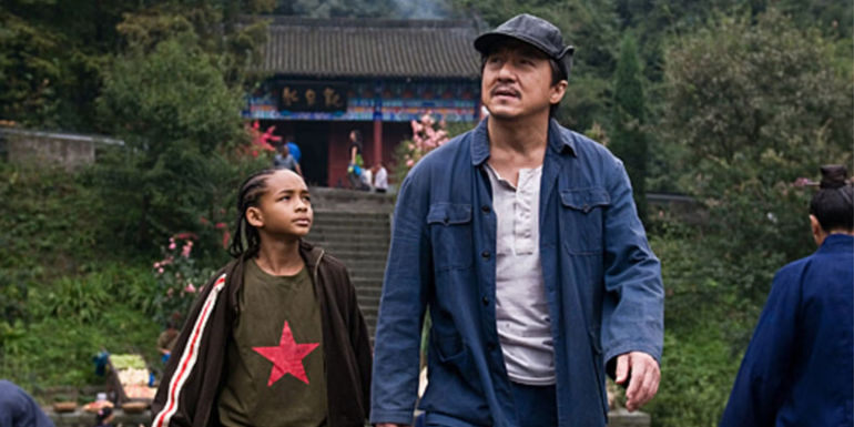 Jaden Smith as Dre Parker and Jackie Chan as Mr. Han as they walk along in the Karate Kid 2010 remake