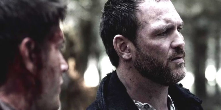 Benny frowning in Purgatory next to Dean in Supernatural season 8