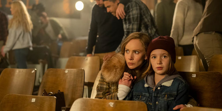 juno temple in in an auditorium with a child in fargo season 5
