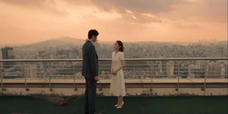 Ji-won and Ji-hyuk looking at each other on a rooftop in Marry My Husband episode 6