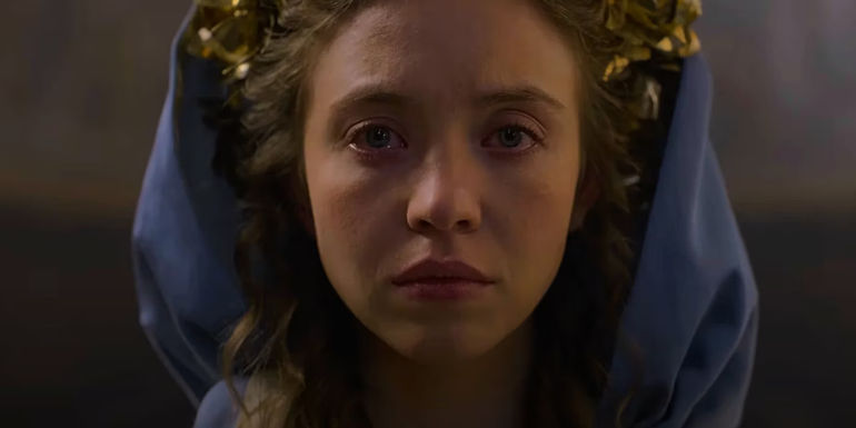 Sydney Sweeney's heroine stares forward, crying, in Immaculate's trailer