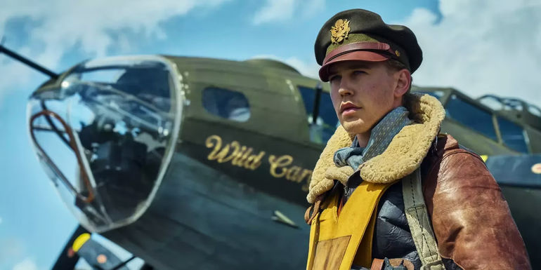 Austin Butler in front of a plane in Masters of the Air