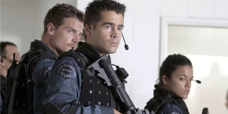 Colin Farrell as Jim Street in uniform, holding a gun in SWAT