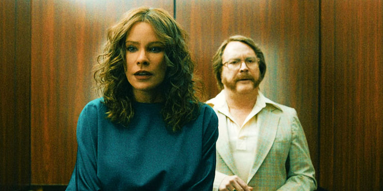 Sofia Vergara as Griselda Blanco and Christian Tappan as Arturo Mesa looking concerned in an elevator in Griselda miniseries