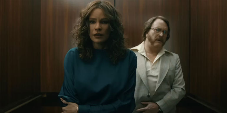 Sofia as Griselda in elevator with Arturo behind her.