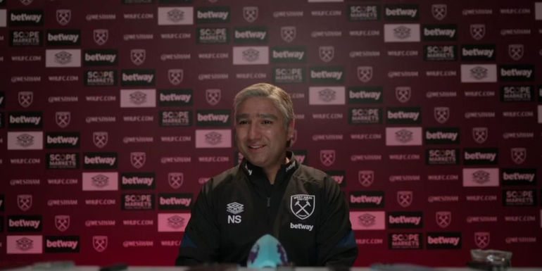 Nate at a press conference in Ted Lasso