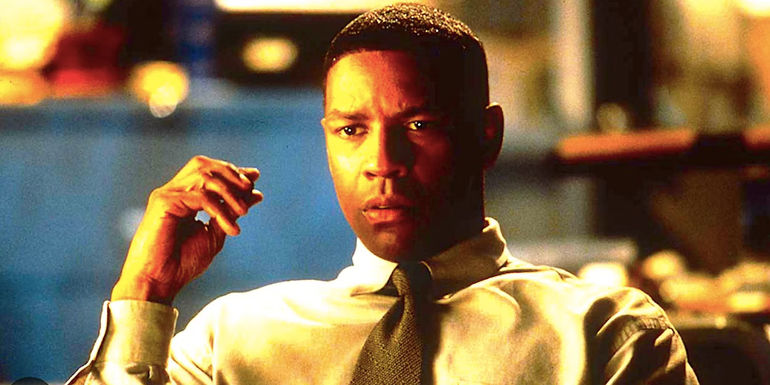 Denzel Washington's Cobb stares ahead lost in thought in Fallen 