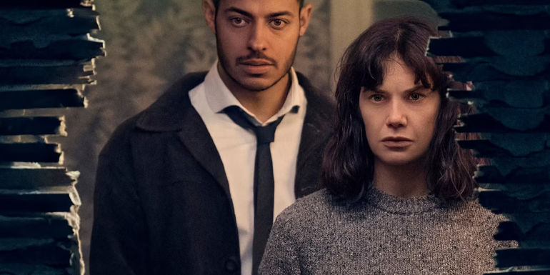 Ruth Wilson in front of a broken wall with Young Colman in The Woman In The Wall