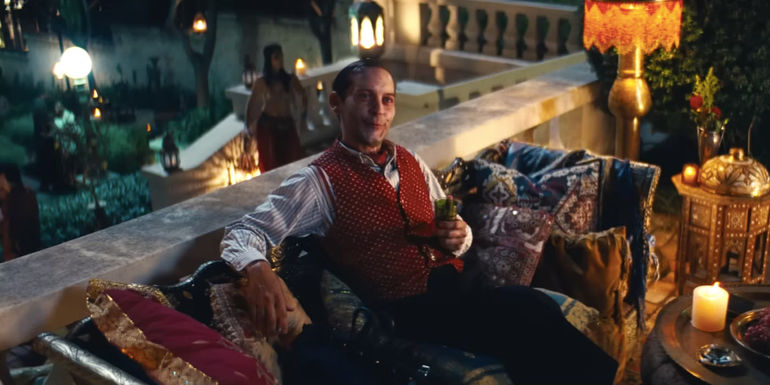 Tobey Maguire as James McKay sitting on a balcony in Babylon