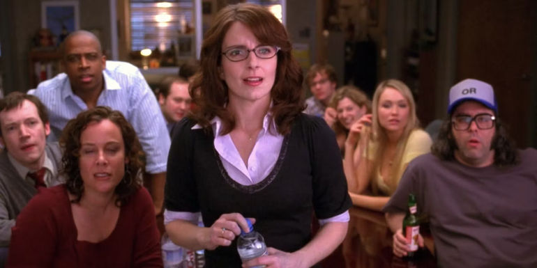 Liz standing in front of the writers in 30 Rock 