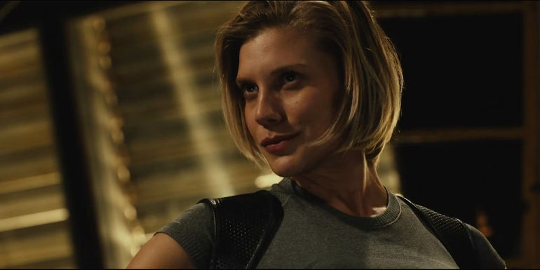 Starbuck smirks and looks off to the side in Battlestar Galactica.