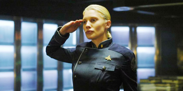 Katee Sackhoff saluting as Starbuck in Battlestar Galactica.