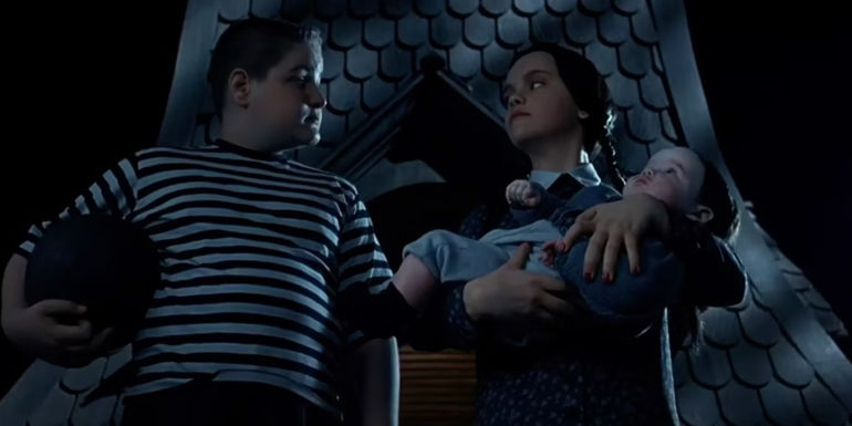 Pugsley and Wednesday on the roof with baby Pubert in Addams Family Values