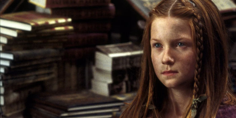 A dirt covered Ginny Weasley (Bonnie Wright) being antagonised in Flourish and Blotts in Harry Potter and the Chamber of Secrets