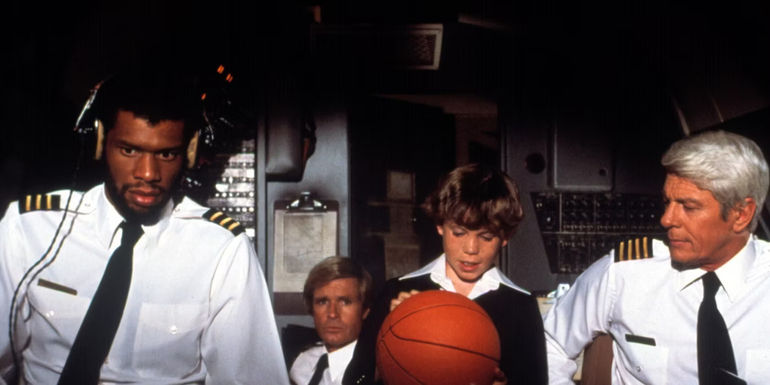 Captain Oveur and Roberg Murdock in the cockpit on Airplane.
