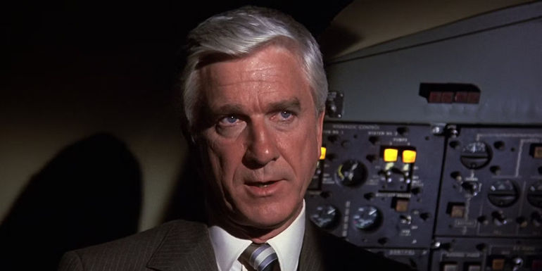 Leslie Nielsen looks on in Airplane!