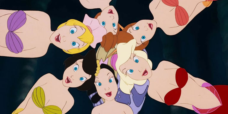 Ariel's six sisters staring straight into the camera in the animated The Little Mermaid