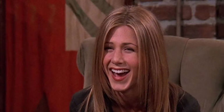 Rachel Green laughing in Central Perk
