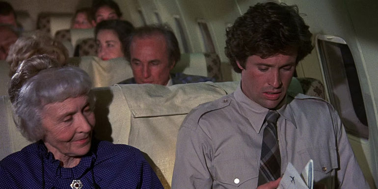 Ted sitting next to a kind woman in Aieplane