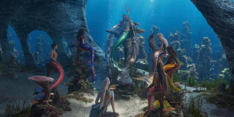 Triton meeting with his daughters in the live-action The Little Mermaid