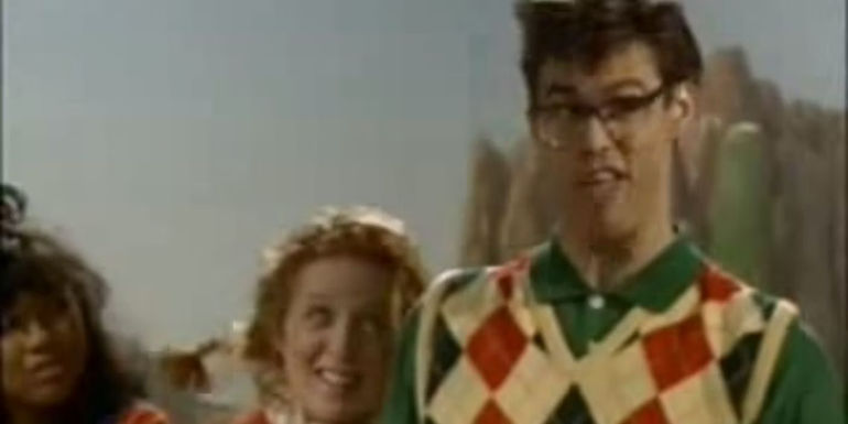 Parnell (Jim Carrey) makiong a face with Edna (Kelly Coffield) smiling next to him.