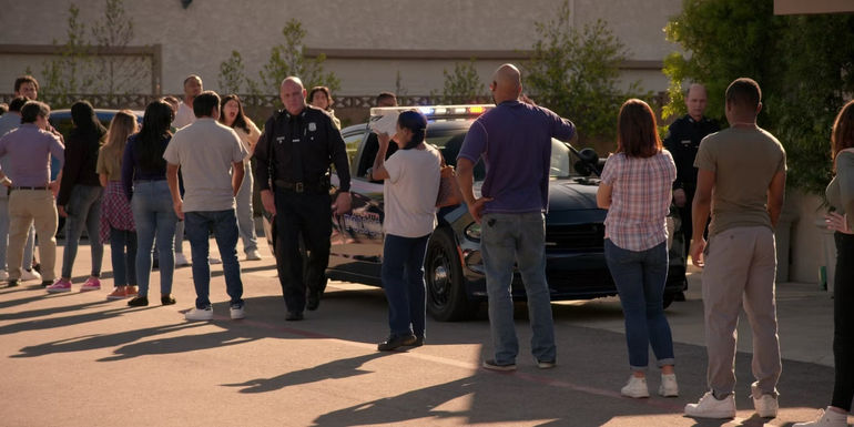 Police officers arrive at a polling station in Curb Your Enthusiasm
