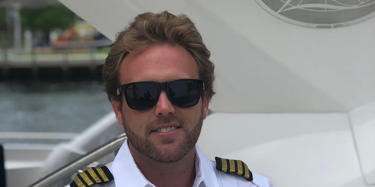 Below Deck Jared Woodin in a captain uniform