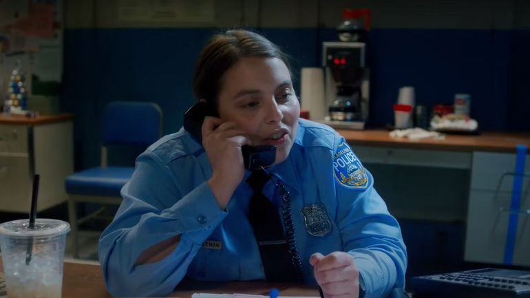 Beanie Feldstein talking on the phone in Drive-Away Dolls